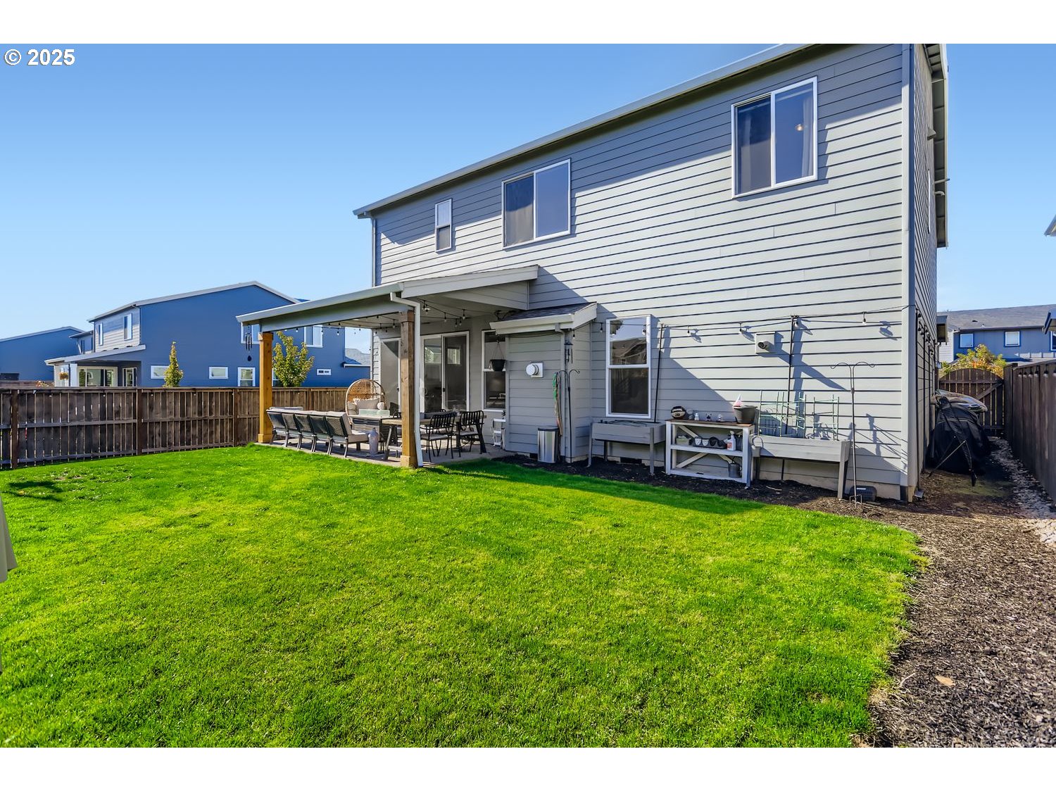 3651 Tiana Street Forest Grove, OR 97116 - Photo 27 of 27 a view of a house with a backyard porch and sitting area