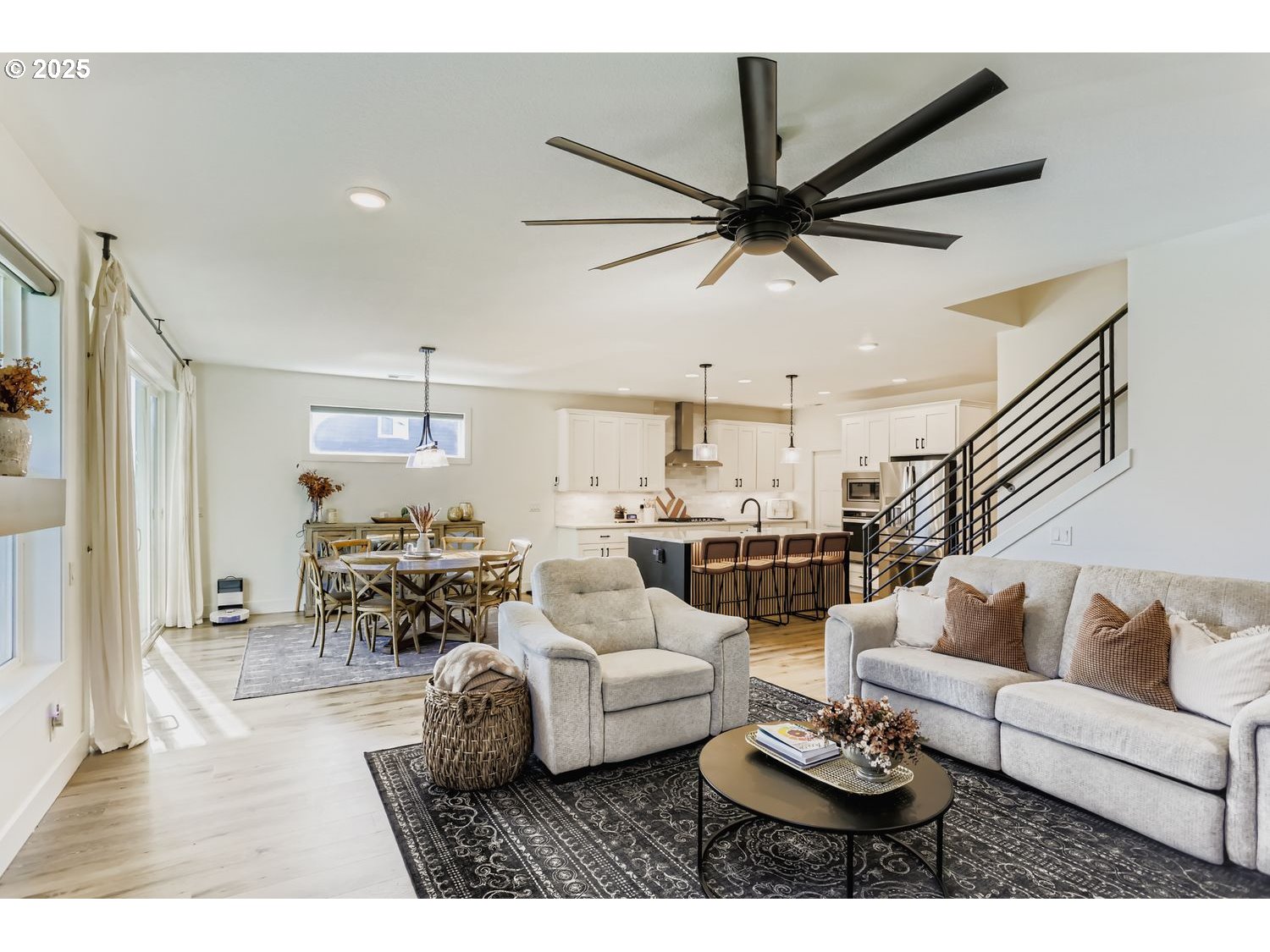 3651 Tiana Street Forest Grove, OR 97116 - Photo 8 of 27 a living room with furniture kitchen view and a wooden floor