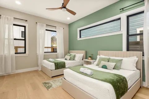 a bedroom with a bed and a mirror