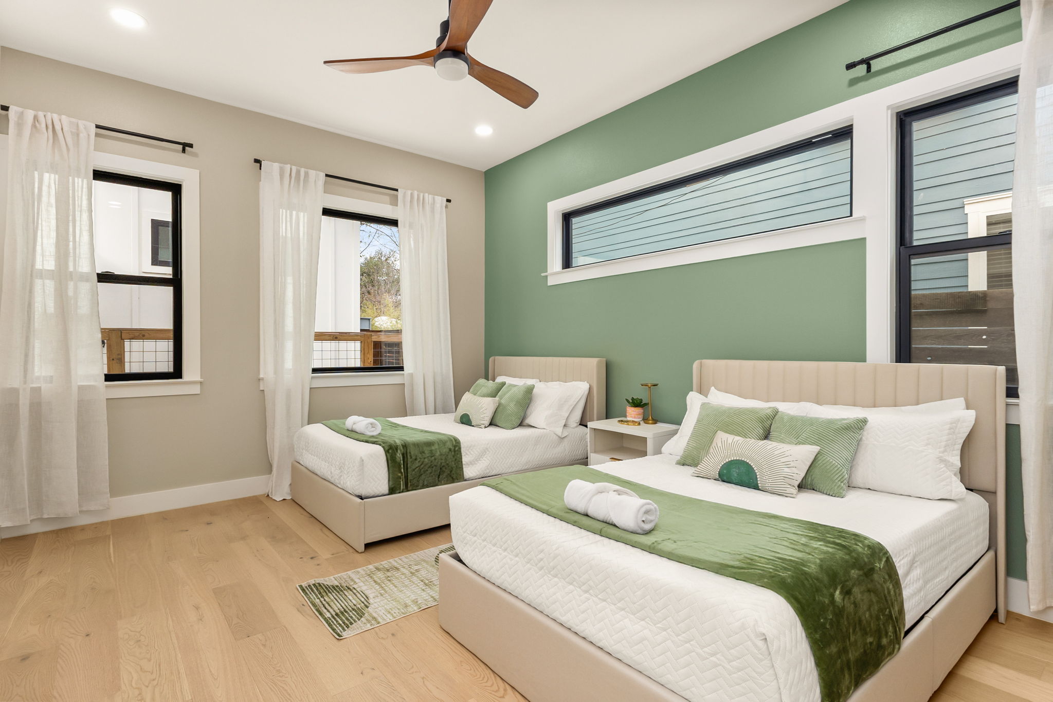 4418 Red River Street, Unit 1 Austin, TX 78751 - Photo 15 of 40 Bedroom featuring light wood-type flooring, a ceiling fan, and recessed lighting