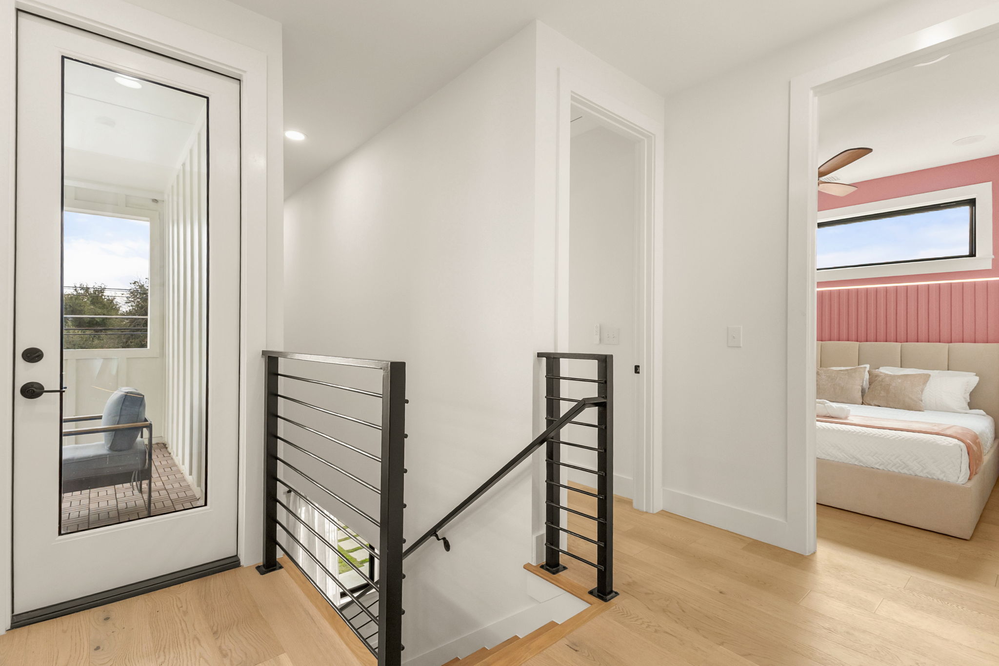 4418 Red River Street, Unit 1 Austin, TX 78751 - Photo 22 of 40 Hall featuring an upstairs landing, healthy amount of natural light, and light wood-style floors
