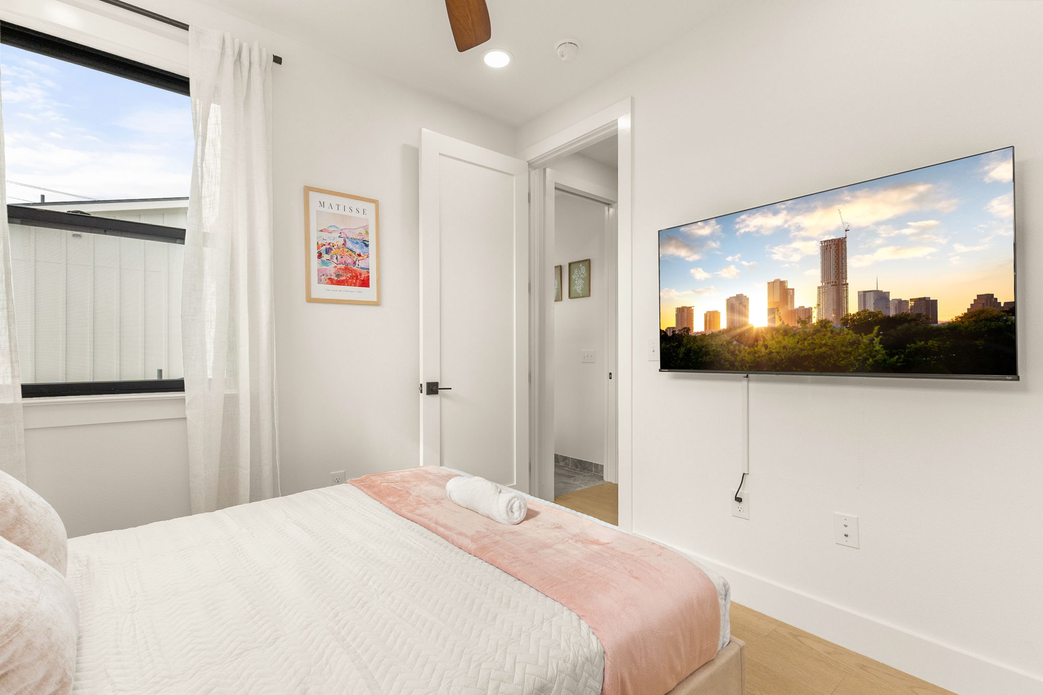 4418 Red River Street, Unit 1 Austin, TX 78751 - Photo 24 of 40 Bedroom with a ceiling fan, recessed lighting, and light wood-style flooring