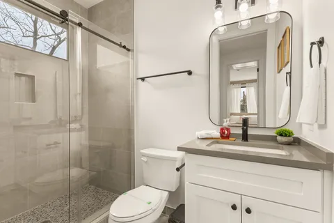 a view of a two chairs in the patio