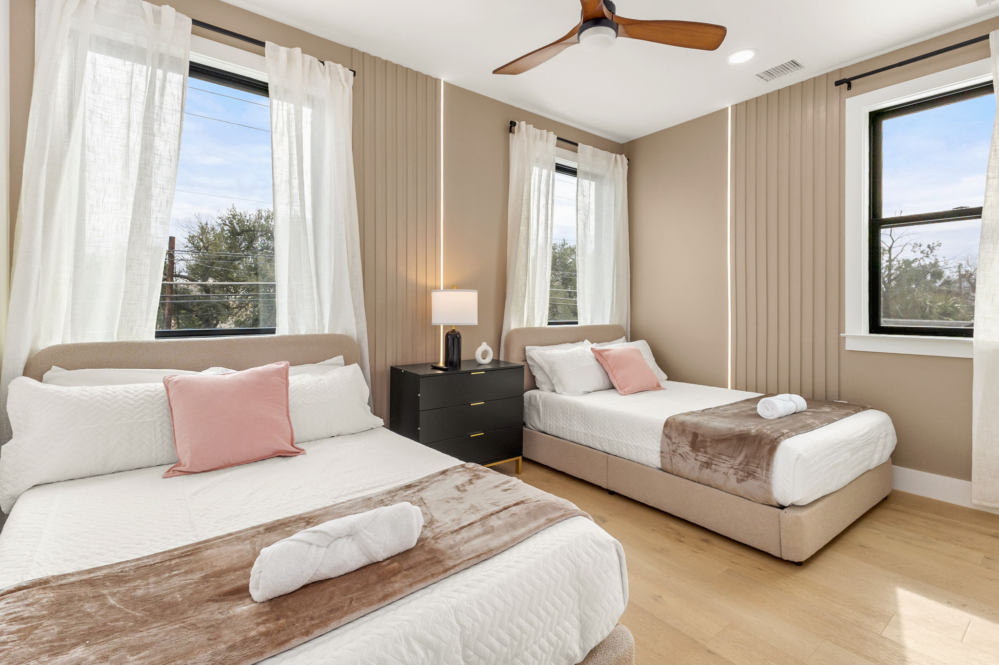 4418 Red River Street, Unit 1 Austin, TX 78751 - Photo 26 of 40 Bedroom featuring wood finished floors and a ceiling fan