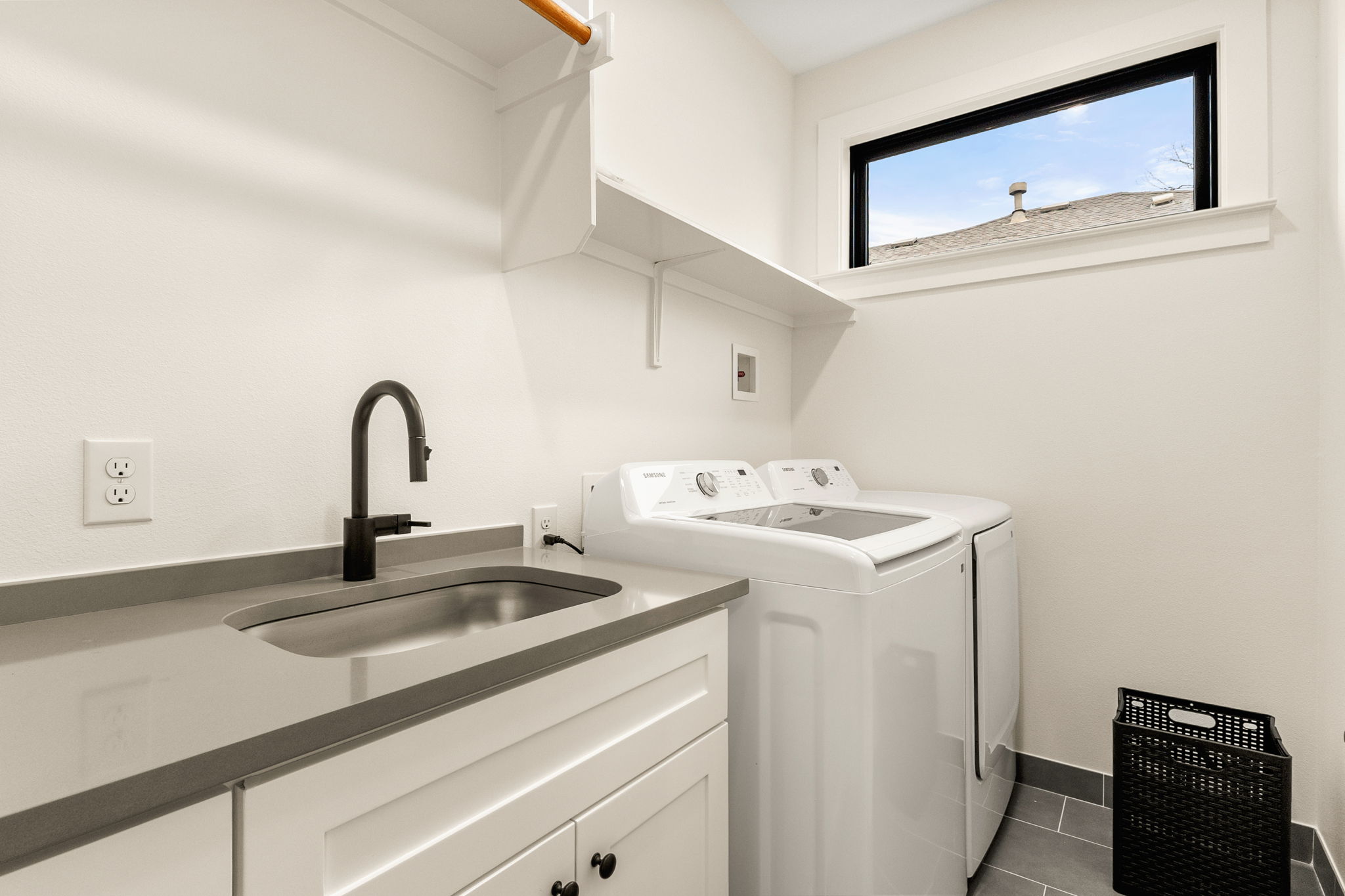 4418 Red River Street, Unit 1 Austin, TX 78751 - Photo 28 of 40 Laundry room featuring washer and dryer, tile patterned floors, and cabinet space