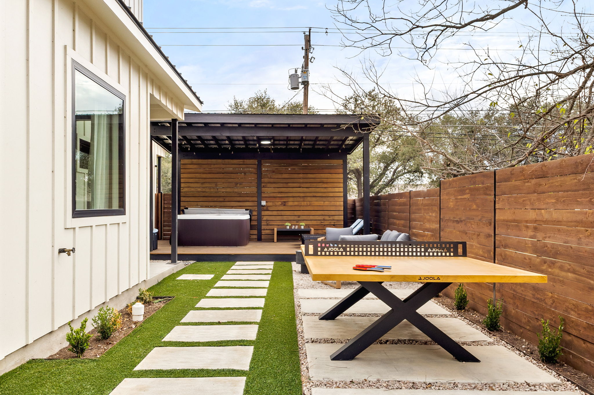 4418 Red River Street, Unit 1 Austin, TX 78751 - Photo 34 of 40 Fenced yard with a patio area and a hot tub