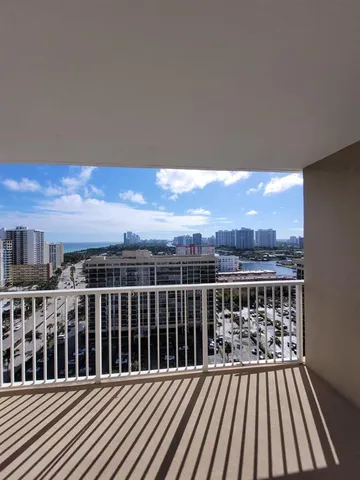 a view of a balcony with wooden floor