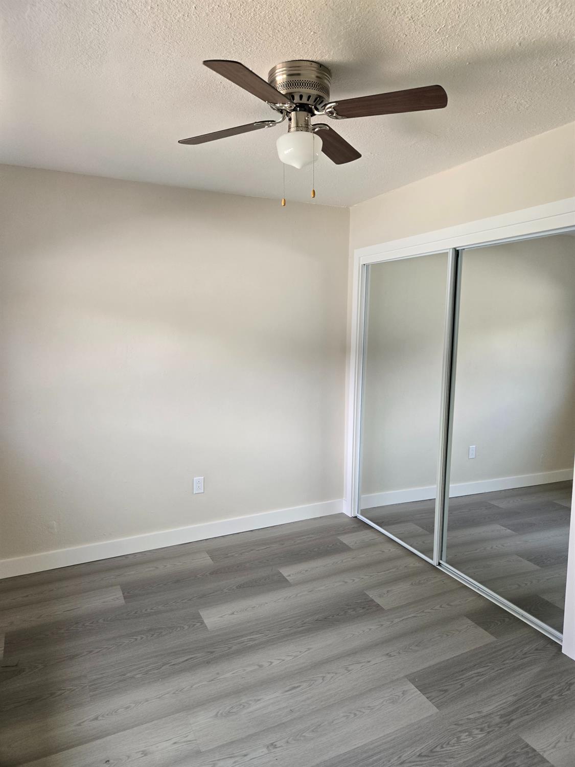 1036 North Sutter Street, Unit 5 Stockton, CA 95202 - Photo 5 of 10 wooden floor in an empty room