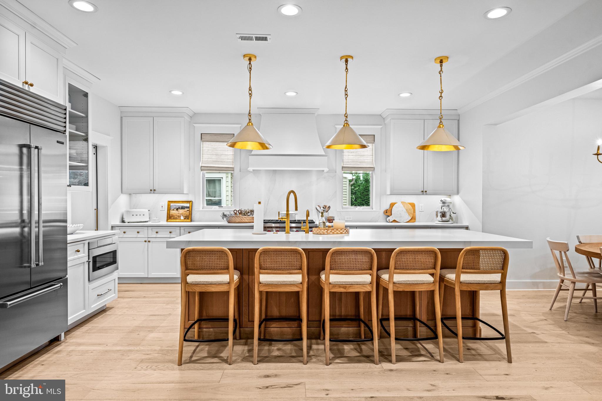 37 Estaugh Avenue Haddonfield, NJ 08033 - Photo 24 of 68 a open kitchen with stainless steel appliances granite countertop a dining table chairs sink refrigerator and microwave