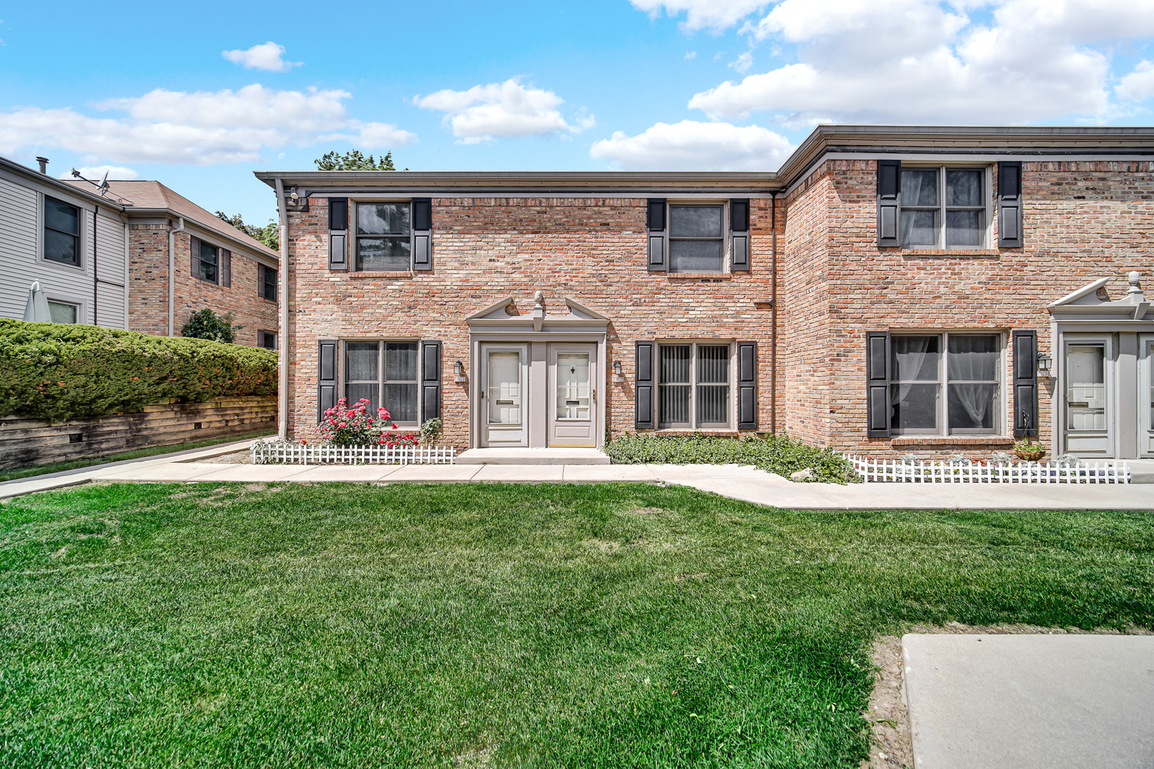 a front view of a house with a yard