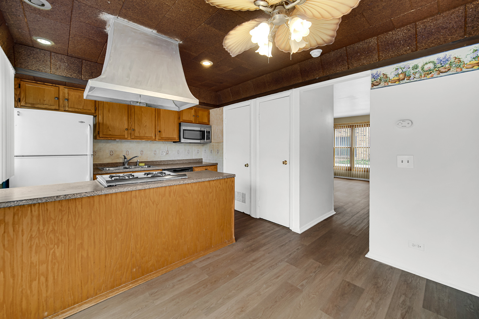 1746 Sessions Walk, Unit 1746 Hoffman Estates, IL 60169 - Photo 11 of 19 a kitchen with stainless steel appliances granite countertop a sink a stove and a refrigerator