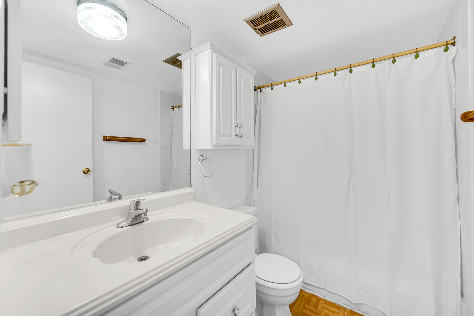 1746 Sessions Walk, Unit 1746 Hoffman Estates, IL 60169 - Photo 15 of 19 a bathroom with a sink a toilet and shower curtain