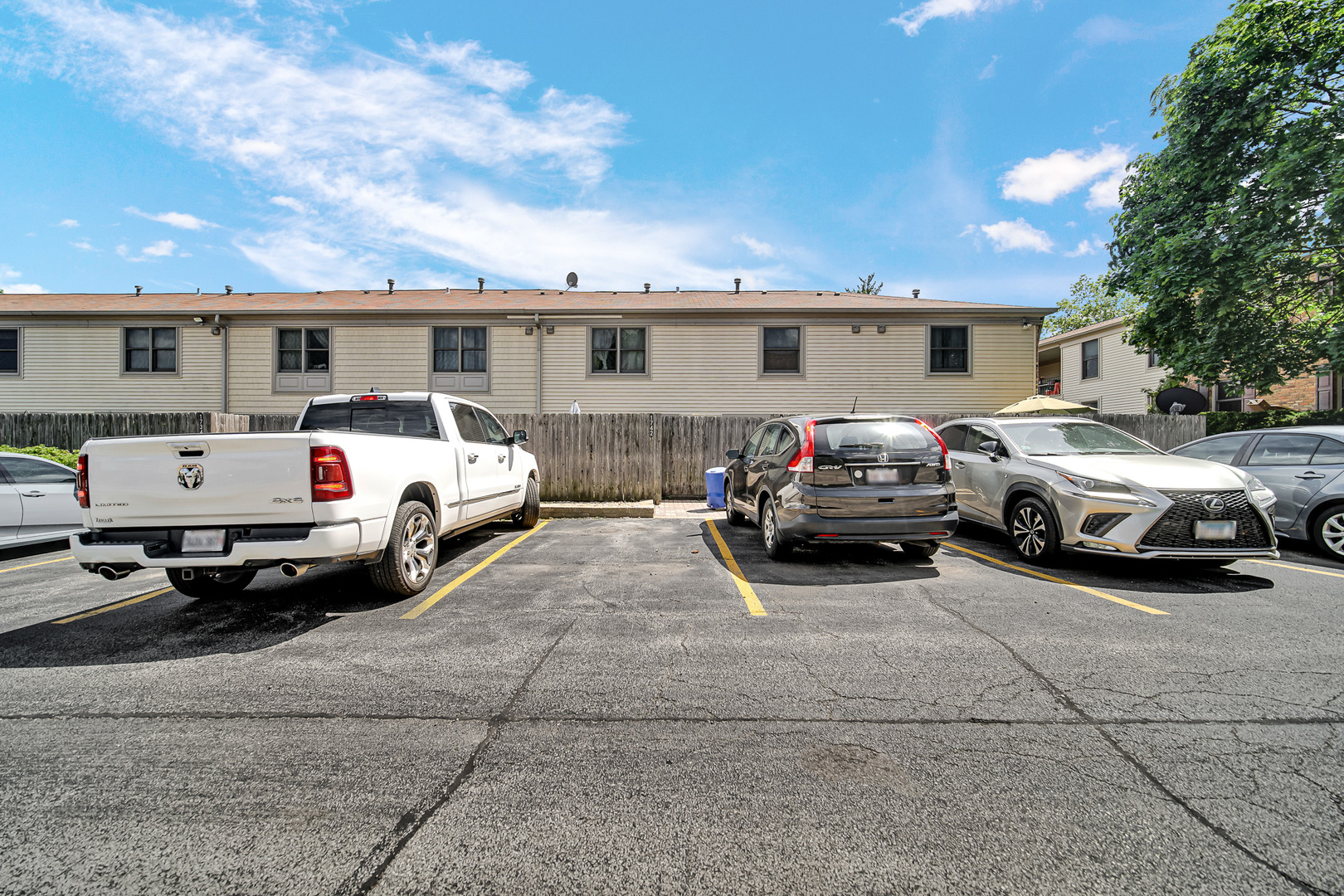 1746 Sessions Walk, Unit 1746 Hoffman Estates, IL 60169 - Photo 18 of 19 a view of cars parked in front of a house