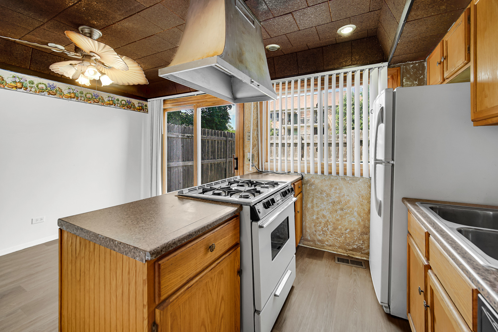 1746 Sessions Walk, Unit 1746 Hoffman Estates, IL 60169 - Photo 9 of 19 a kitchen with a stove and a refrigerator
