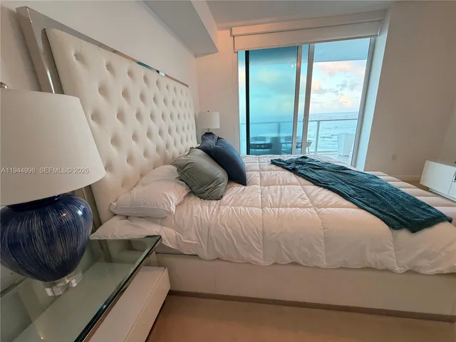 a view of a kitchen area with furniture and mirror