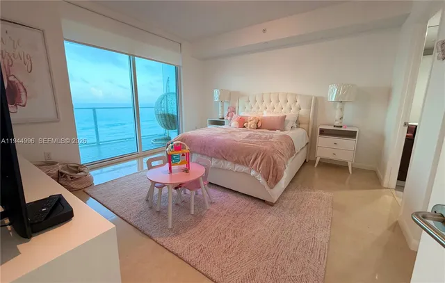 a bed room with a bed and a window