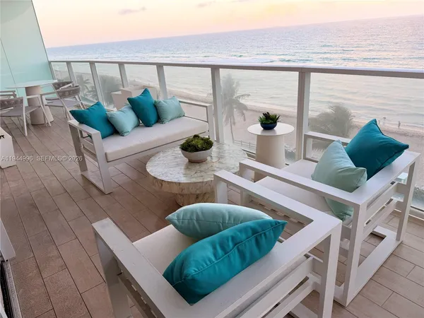 a view of livingroom with furniture and natural light