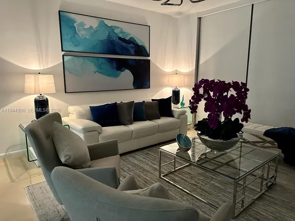 a living room with furniture and a window