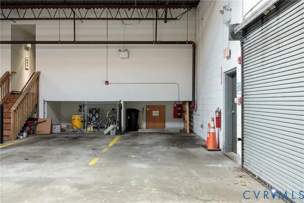 a view of a garage with rack and bicycle