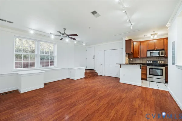 a view of a kitchen with microwave and stove