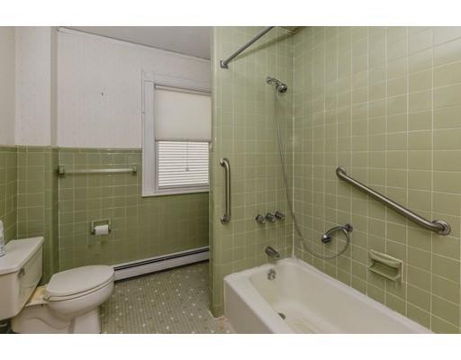80 Barrows Street Dedham, MA 02026 - Photo 15 of 28 a bathroom with a toilet a sink and shower
