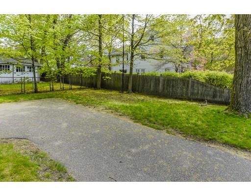 80 Barrows Street Dedham, MA 02026 - Photo 23 of 28 a view of a yard with plants and large trees