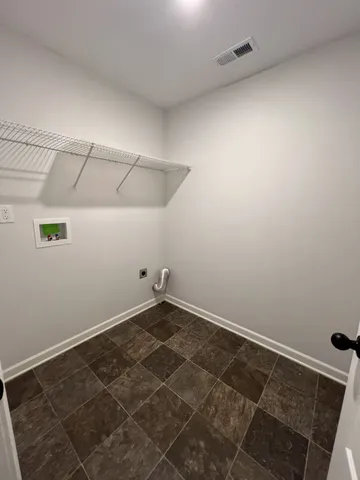 an empty room that has a window