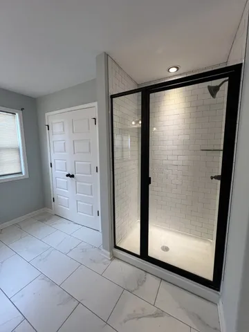 a view of an empty room with a window