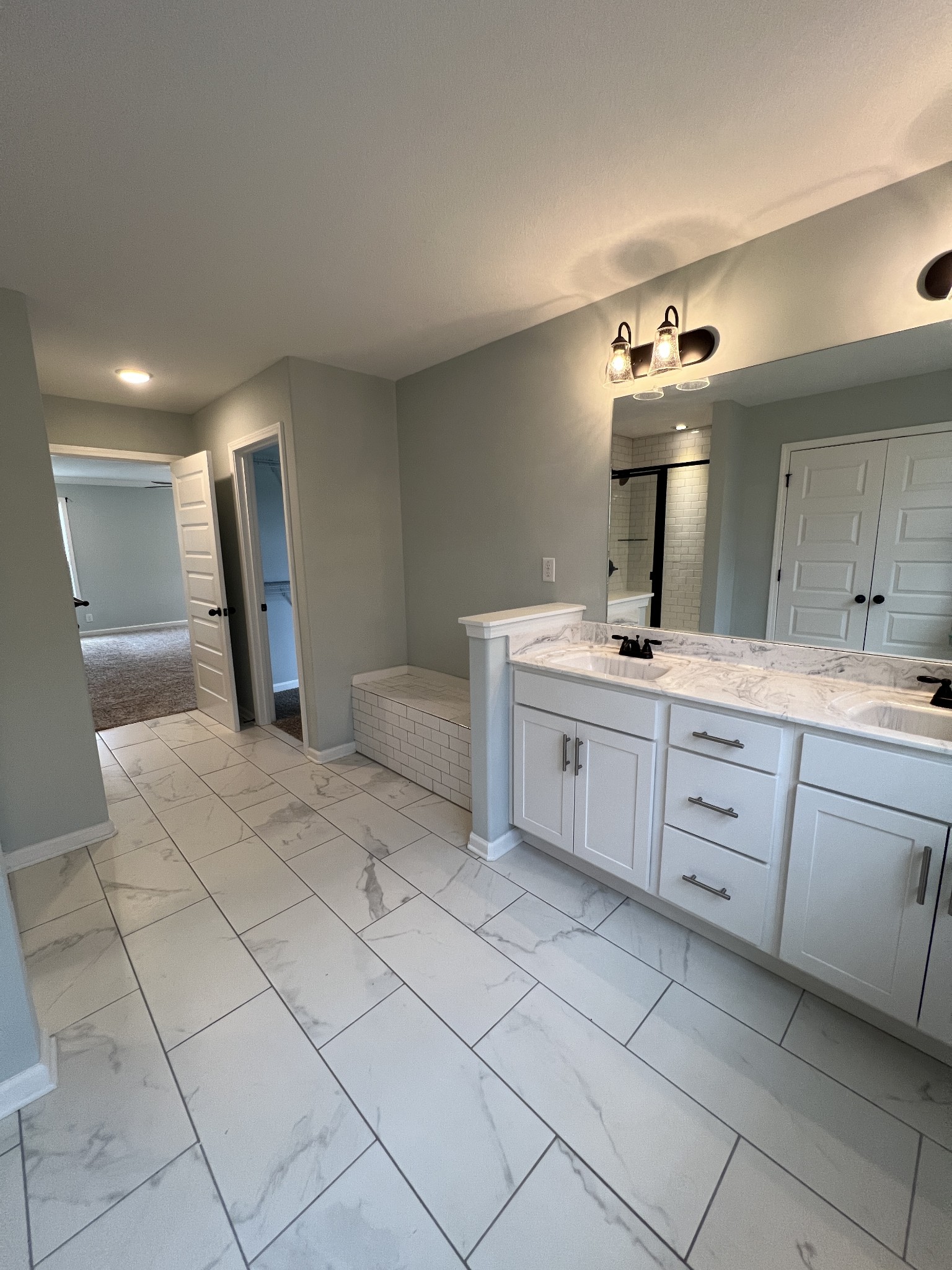 660 Elm Street Clarksville, TN 37040 - Photo 30 of 34 a spacious bathroom with a double vanity sink and a mirror