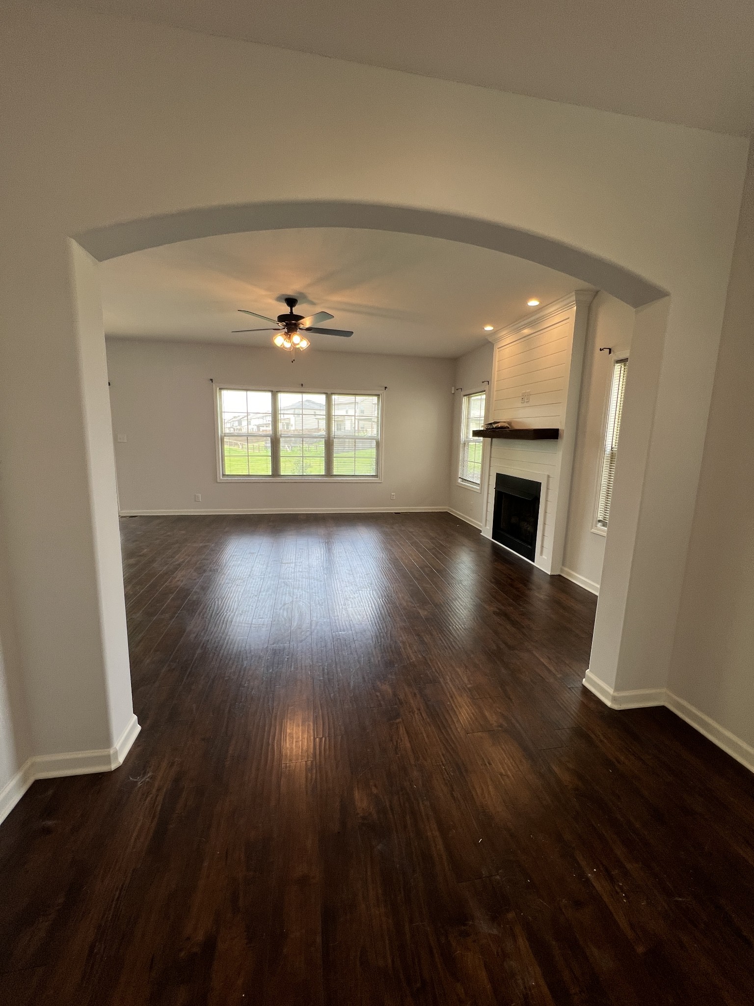 660 Elm Street Clarksville, TN 37040 - Photo 3 of 34 an empty room with wooden floor and windows
