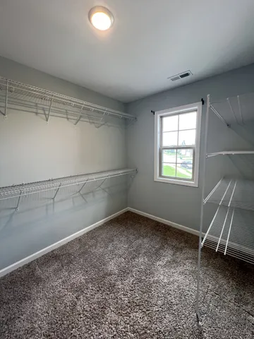 a white toilet sitting next to a white sink