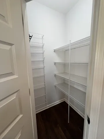 a kitchen with sink a microwave and cabinets