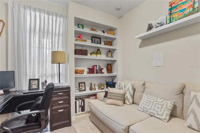 a living room with furniture and a window