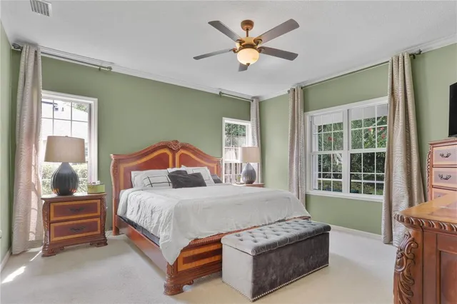 a bedroom with a bed and window