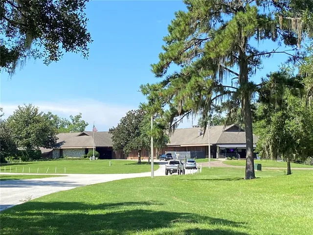 a view of a house with a big yard