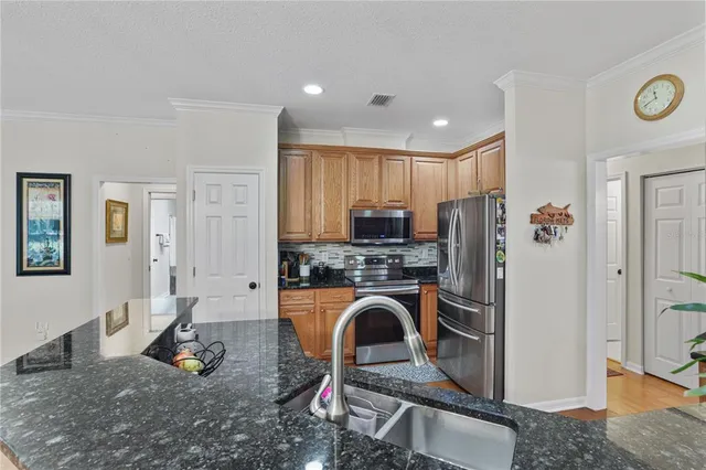 a view of a livingroom with workspace and a couch