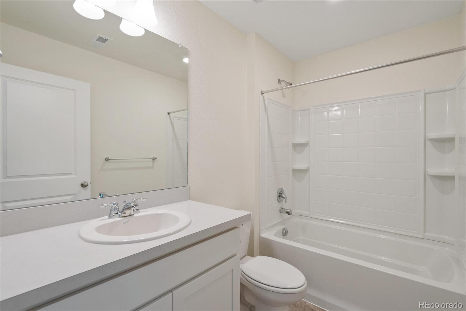 219 Haymaker Lane Severance, CO 80550 - Photo 26 of 44 a bathroom with a sink a toilet and shower