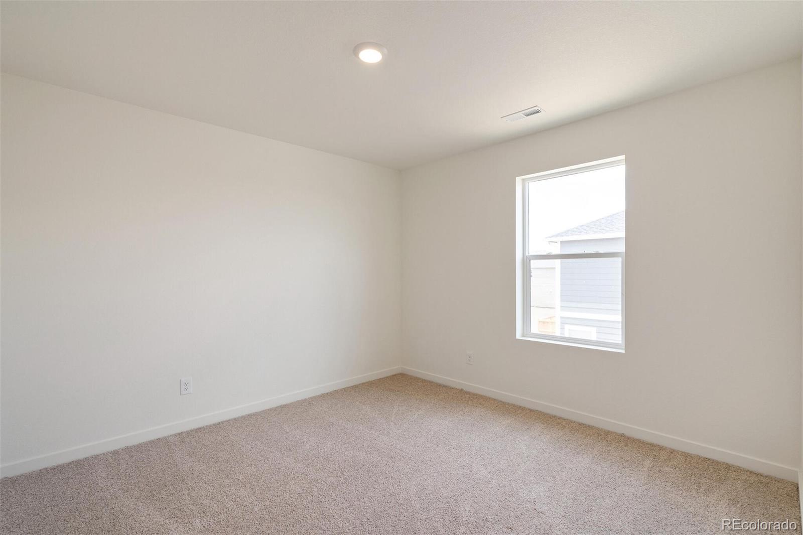 219 Haymaker Lane Severance, CO 80550 - Photo 27 of 44 an empty room with a window