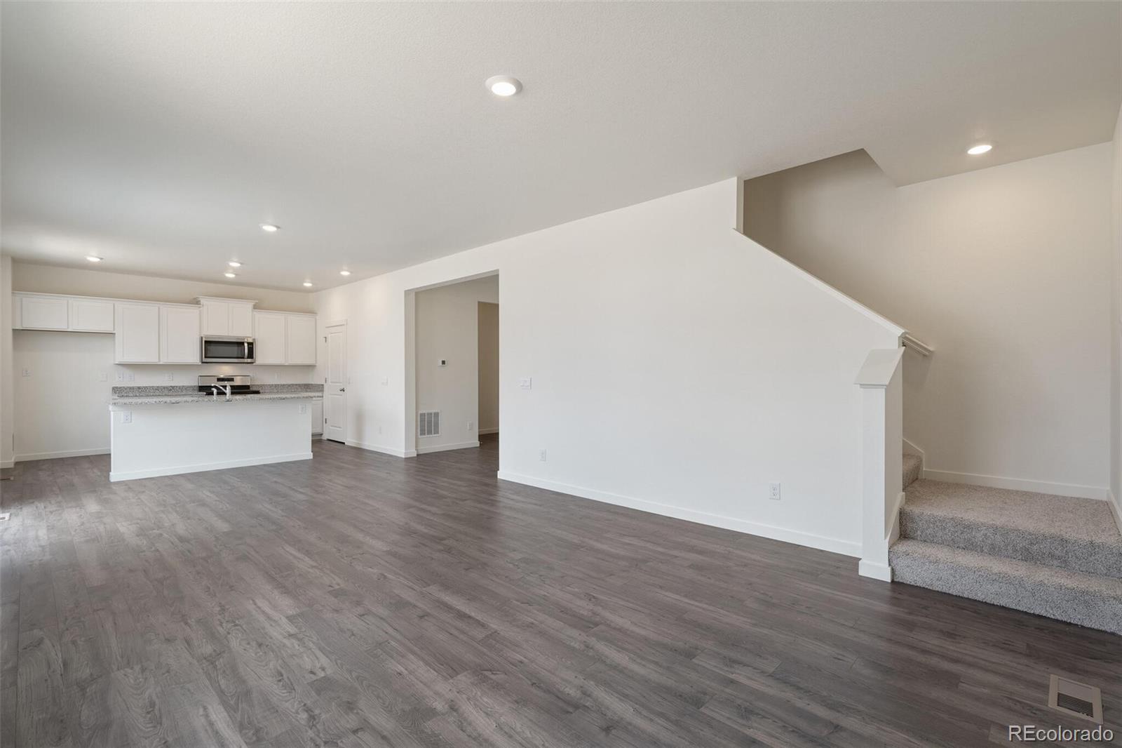 219 Haymaker Lane Severance, CO 80550 - Photo 4 of 44 a view of kitchen with wooden floor