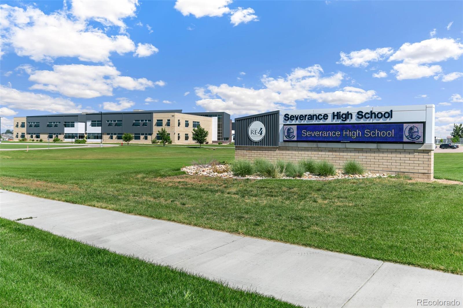219 Haymaker Lane Severance, CO 80550 - Photo 43 of 44 a view of a big house with a big yard