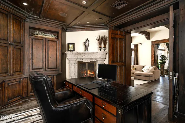 a bedroom with a bed wooden floor and window
