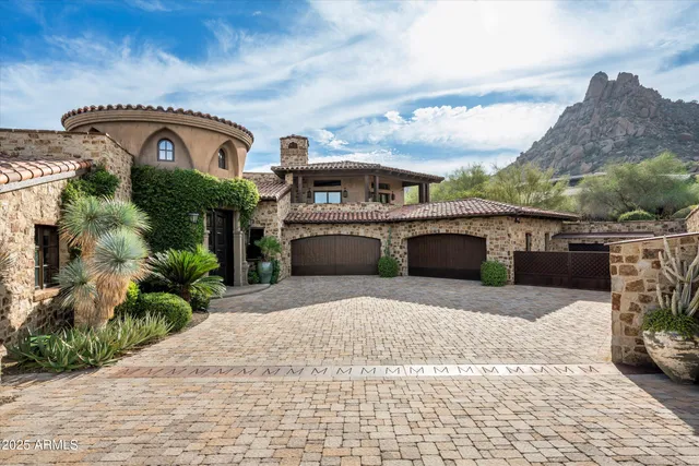 front view of a house with a garden