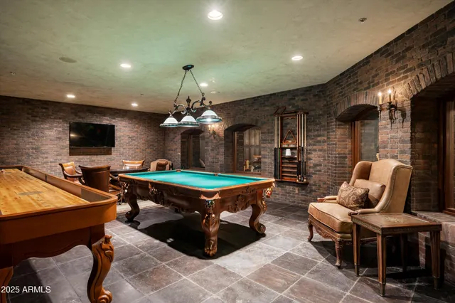 a dining room with a table and chairs