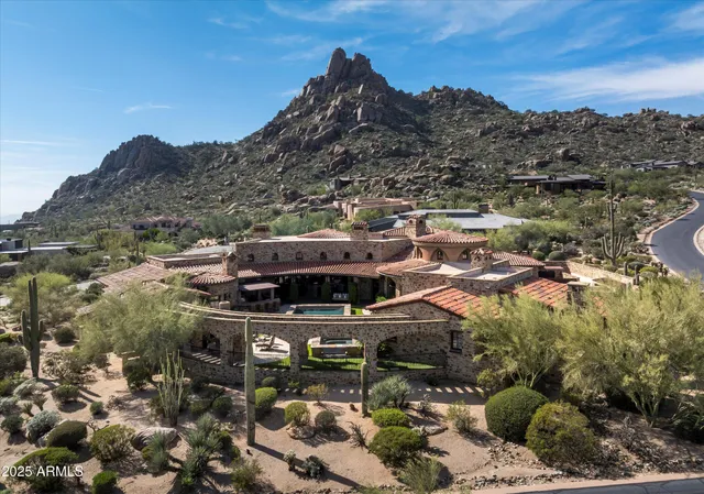 a living room with fireplace furniture and a fireplace