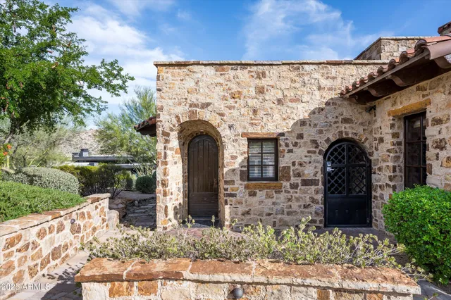 a kitchen with stainless steel appliances granite countertop a stove and cabinets