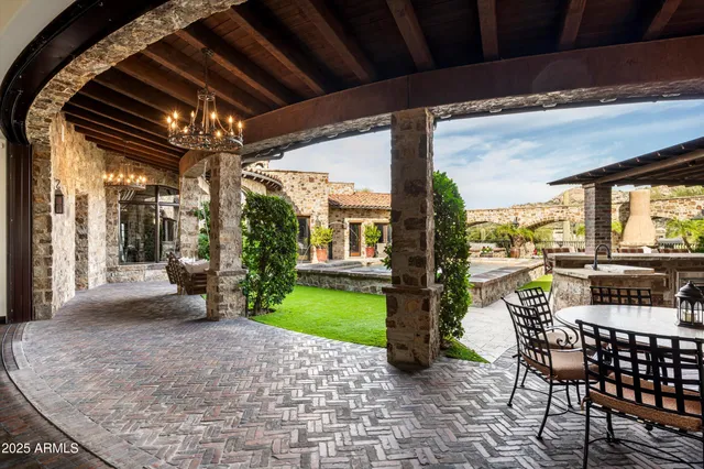 a view of a house with swimming pool and sitting area