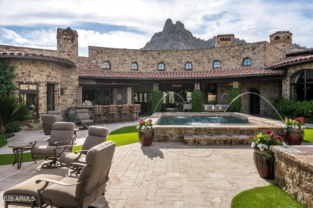 a view of a porch with furniture and floor to ceiling window