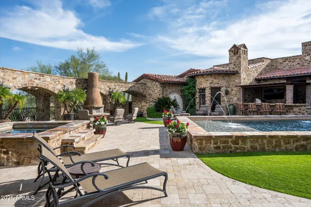 a kitchen with stainless steel appliances granite countertop a stove and a sink