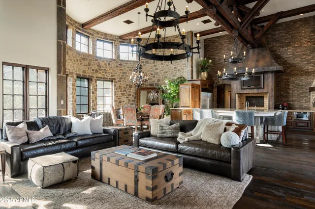 a living room with furniture a rug and a fireplace
