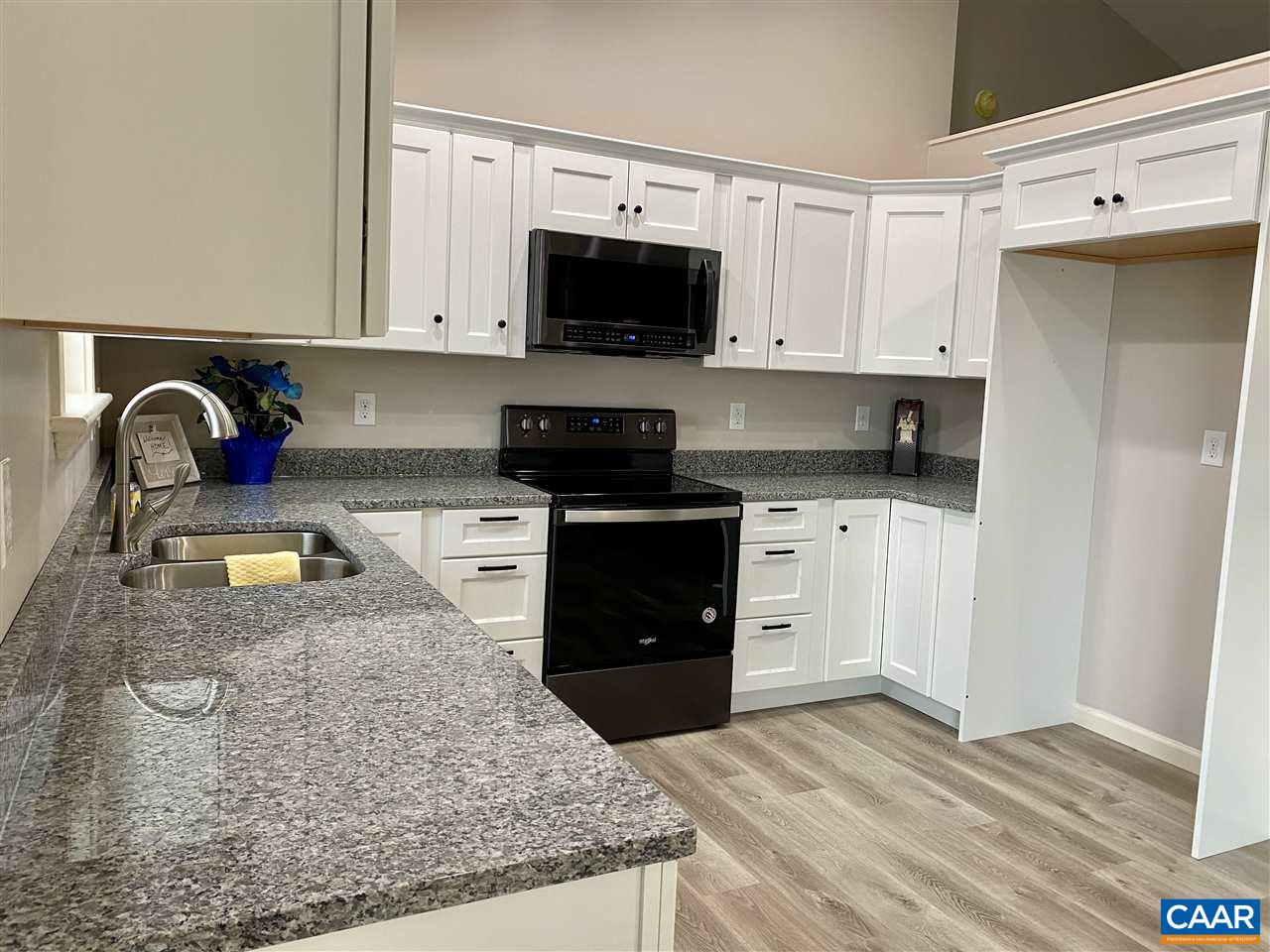 907 New Hope Road Staunton, VA 24401 - Photo 15 of 50 a kitchen with stainless steel appliances granite countertop a stove a sink and a microwave